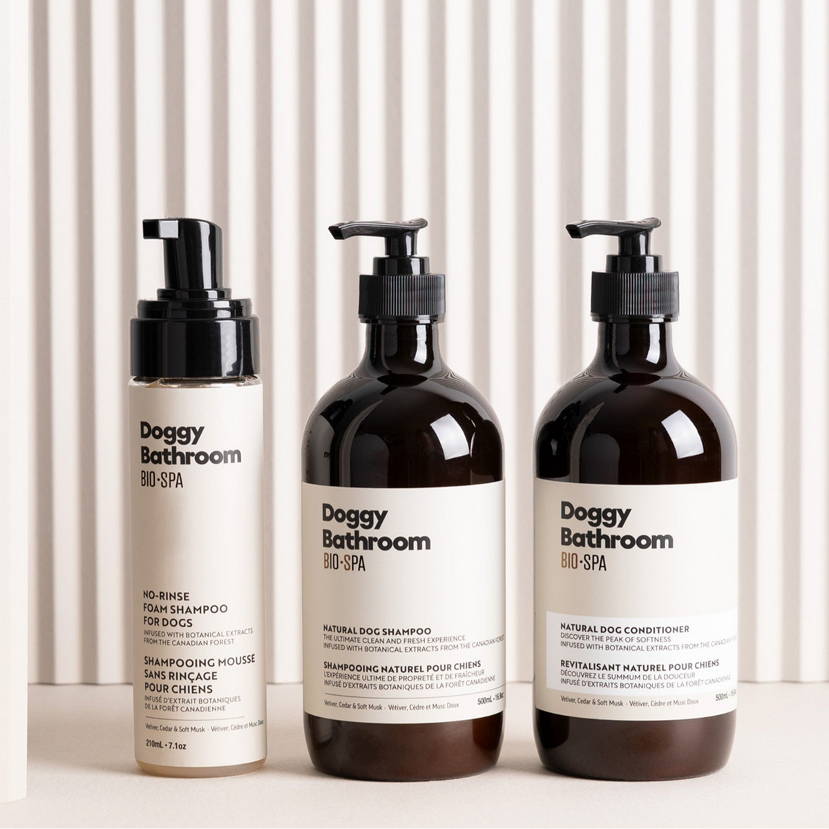 Three bottles of Doggy Bathroom products on a white background